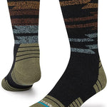 Stance Blanket Statement Socks 2023 - A pair of black socks with a brown and gray patterned design on top.
