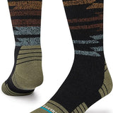 Stance Blanket Statement Socks 2023 - A pair of black socks with a brown and gray patterned design on top.