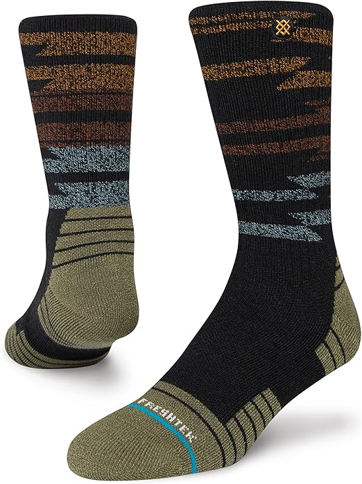 Stance Blanket Statement Socks 2023 - A pair of black socks with a brown and gray patterned design on top.