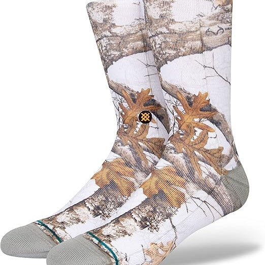 Stance X Realtree Edge Color Crew Sock 2023 - A pair of crew socks with a brown and tan camouflage pattern on a white background.