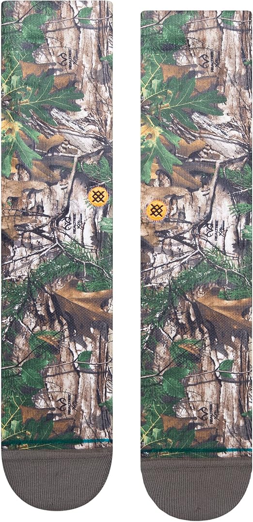 Stance x Realtree Kid's Xtra Crew Sock 2023 - Camo pattern with green, brown, and tan hues on a white background.
