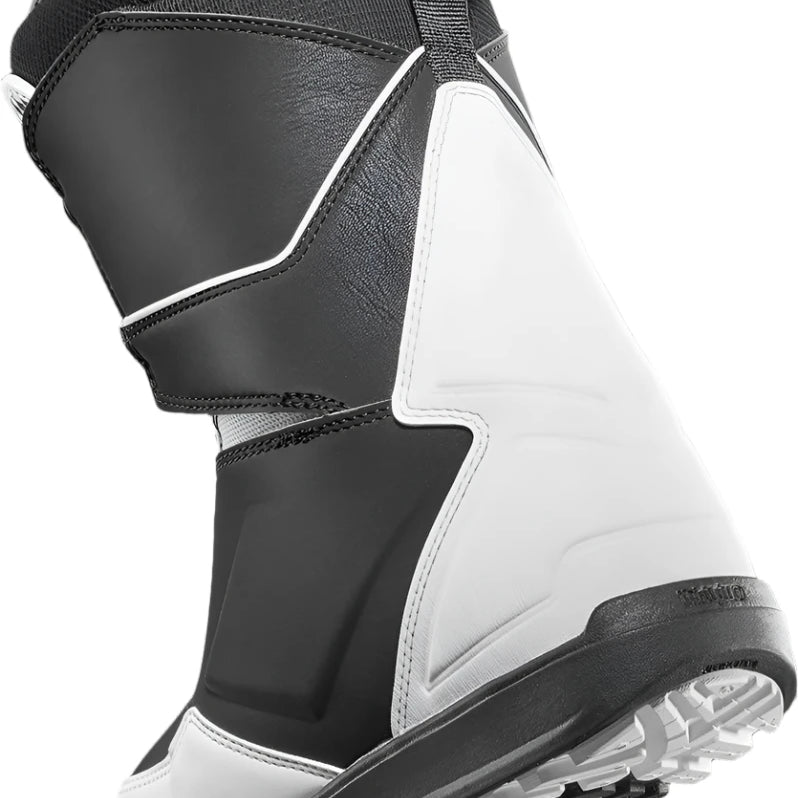 ThirtyTwo Women's Lashed Double BOA x Melancon Snowboard Boot 2024 - Black snowboard boot with a white logo on top and a strap that goes around the ankle.