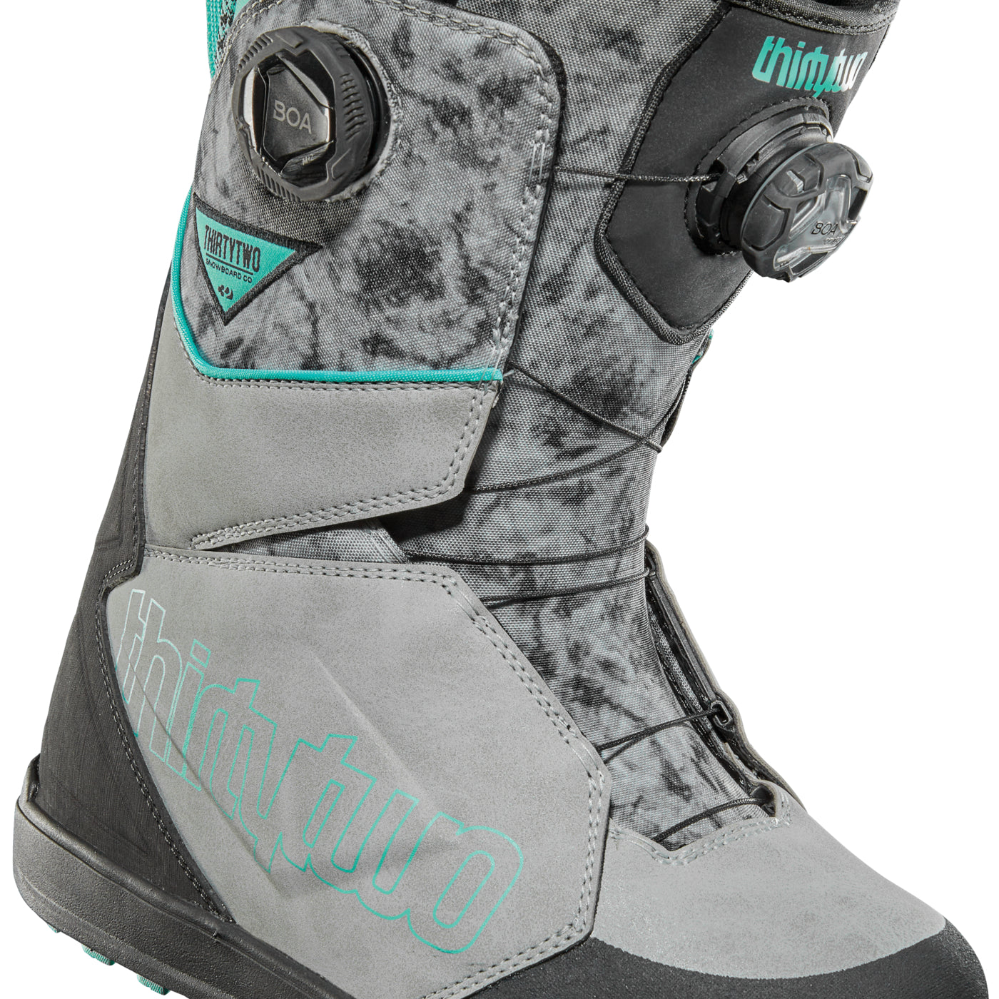 ThirtyTwo Women's Lashed Double BOA Snowboard Boot 2025 - A gray and black snowboard boot with teal accents, featuring a double BOA closure system on the side.