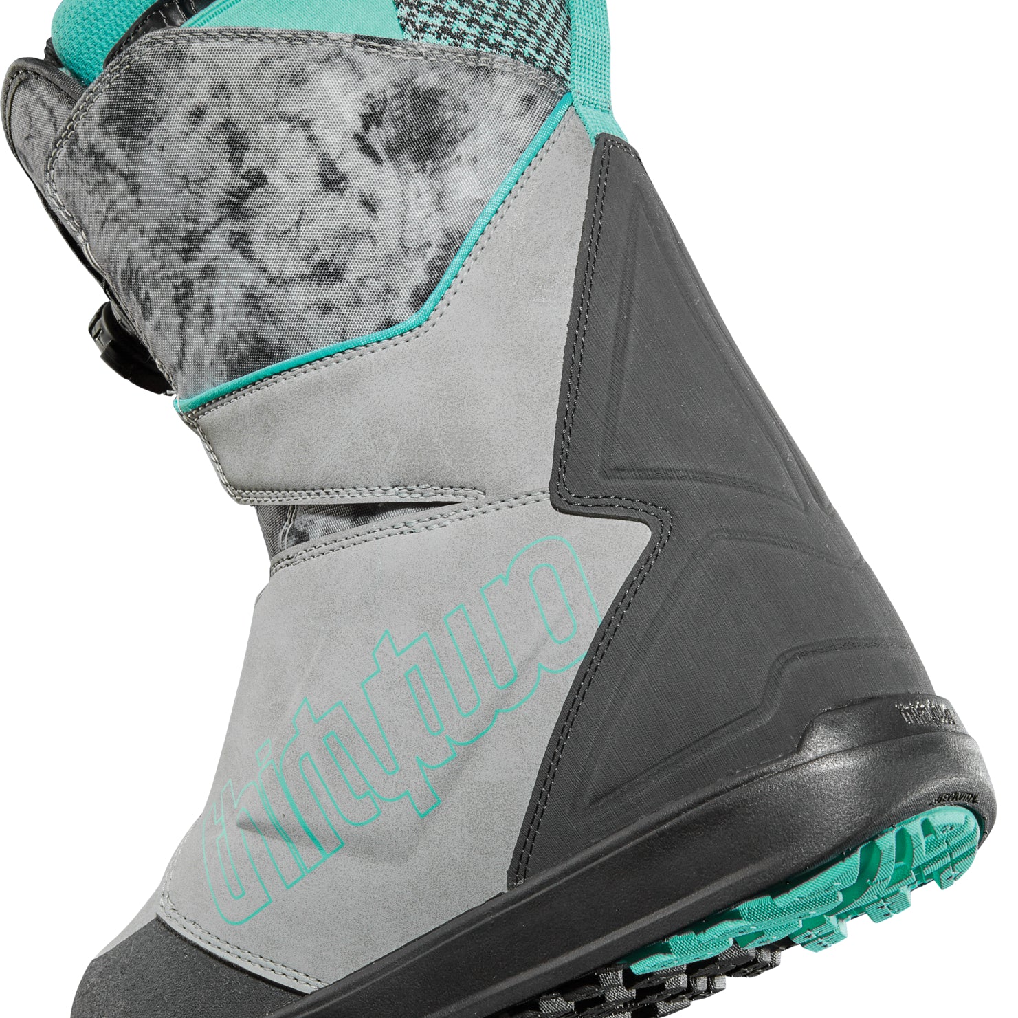 ThirtyTwo Women's Lashed Double BOA Snowboard Boot 2025 - A gray snowboard boot with a black sole and teal accents, featuring two BOA dials on the side.