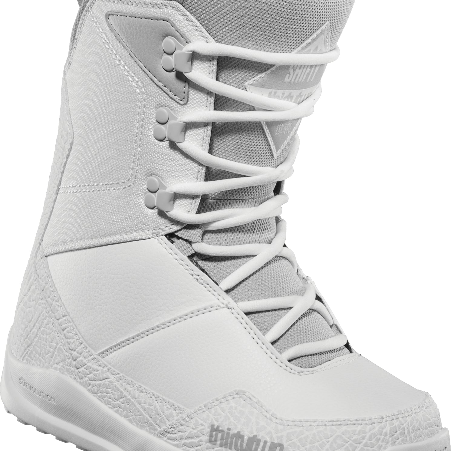 ThirtyTwo Women's Shifty Boot 2025 - A light gray boot with a textured pattern on the toe and heel areas, featuring white laces and a black logo on the side.