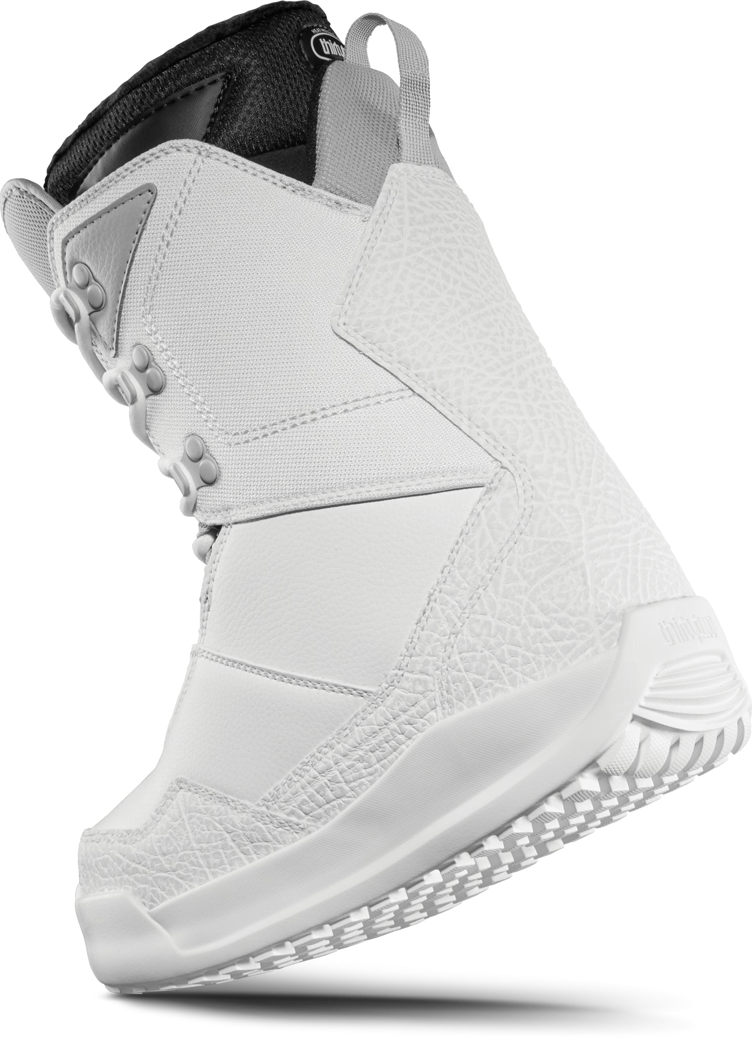 ThirtyTwo Women's Shifty Boot 2025 - A white snowboard boot with a textured pattern on the toe and heel, featuring gray laces and a black strap at the top.