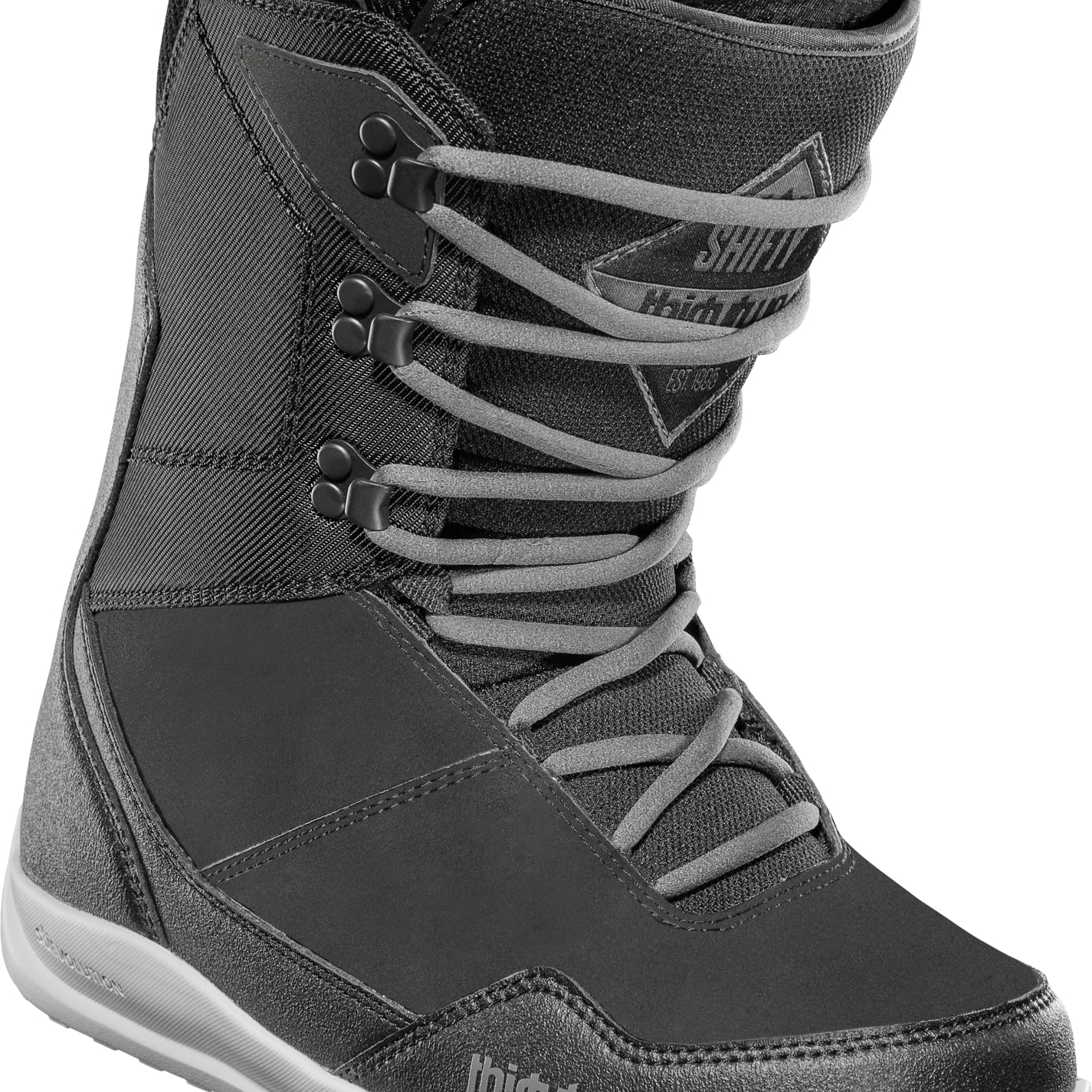 ThirtyTwo Women's Shifty Boot 2025 - A black boot with a textured pattern on the toe and heel, featuring a white sole and laces.