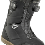 ThirtyTwo Women's Lashed Double BOA X Volcom Snowboard Boot 2025 - Black snowboard boot with a white logo on the side and a black strap with silver hardware.