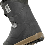 ThirtyTwo Women's Lashed Double BOA X Volcom Snowboard Boot 2025 - A black snowboard boot with a white logo patch on the side featuring a palm tree and the word "Volcom" in cursive.