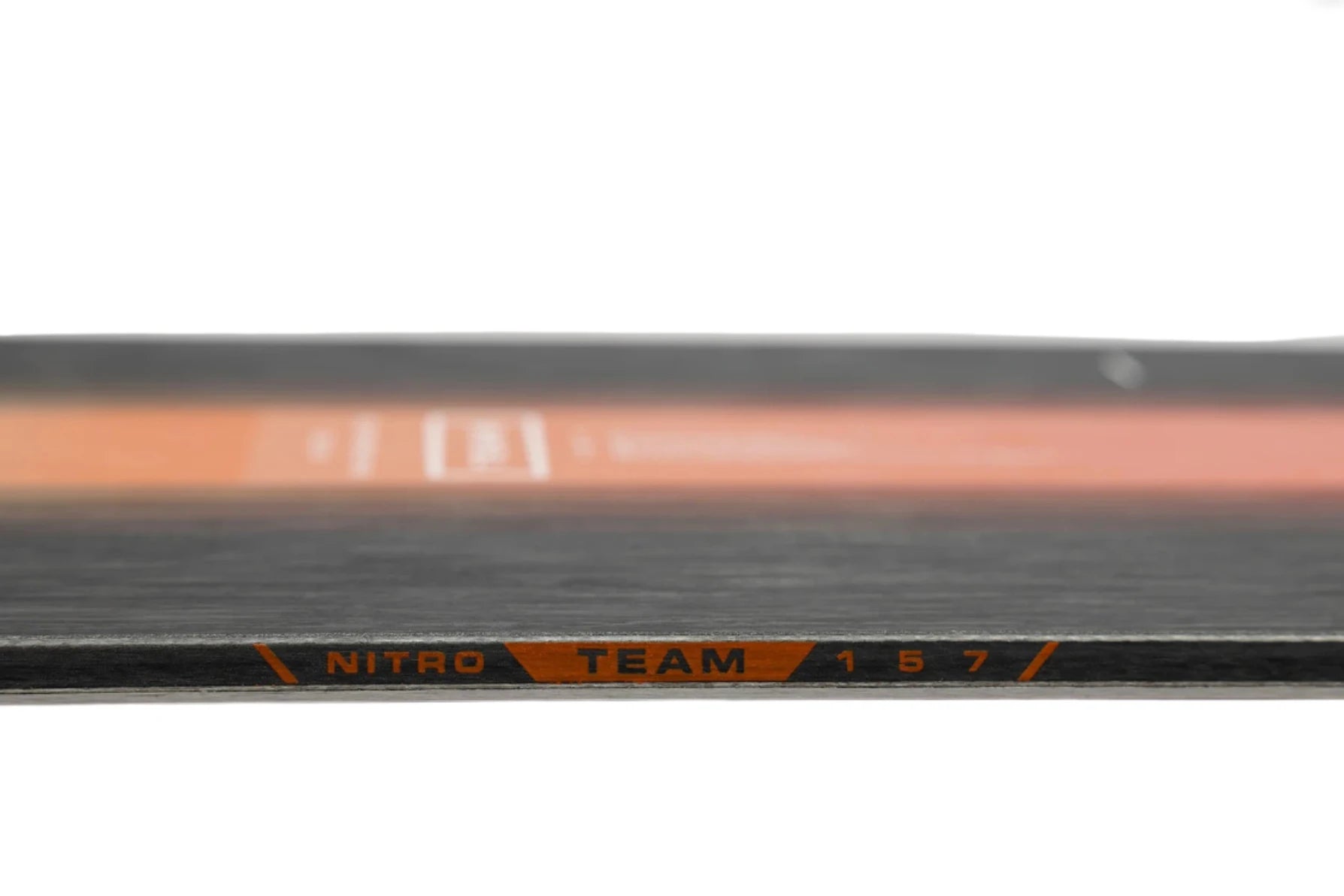 Nitro Team Snowboard 2025 - A black snowboard with white lettering and a red stripe along its bottom edge.