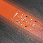 Nitro Team Snowboard 2025 - A black snowboard with a white logo and white lettering on the bindings.