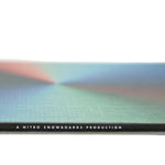 Nitro Cinema Snowboard 2025 - A snowboard with a black base and white lettering on top.