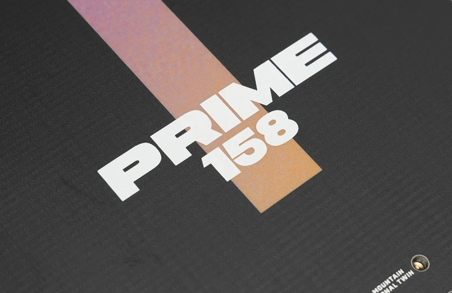 Nitro Prime Chroma Cam-Out Snowboard 2025 - A snowboard with a predominantly black base and a vibrant, multicolored camo pattern on top.