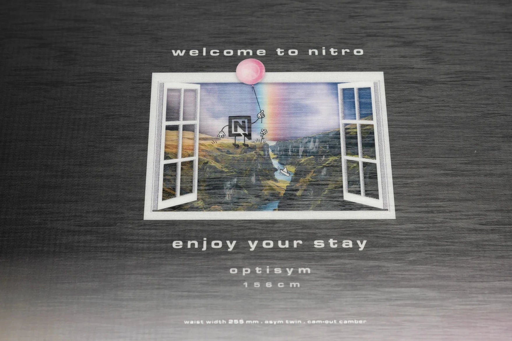 Nitro Optisym Snowboard 2025 - A snowboard with a black base and white lettering, featuring the brand name "nitro" on its side.