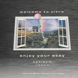 Nitro Optisym Snowboard 2025 - A snowboard with a black base and white lettering, featuring the brand name "nitro" on its side.