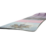 Nitro Cheap Thrills Snowboard 2025 - A snowboard with a light blue background and palm tree graphic on the bottom left corner.