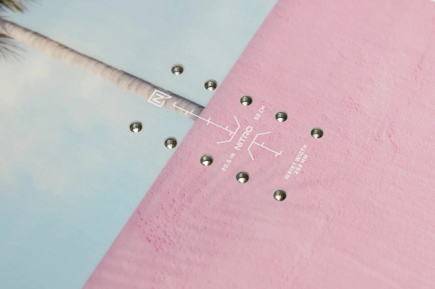 Nitro Cheap Thrills Snowboard 2025 - A light blue snowboard with a white logo on top and silver screws.