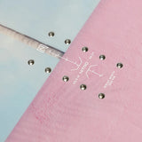 Nitro Cheap Thrills Snowboard 2025 - A light blue snowboard with a white logo on top and silver screws.