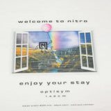 Nitro Women's Optisym Snowboard 2025 - A snowboard with a white base and black binding mounts.