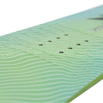 Nitro Youth Ripper x Volcom Snowboard 2025 - A green and blue snowboard with a wavy pattern on its surface.