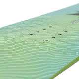 Nitro Youth Ripper x Volcom Snowboard 2025 - A green and blue snowboard with a wavy pattern on its surface.
