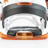 Nitro Phantom Snowboard Bindings 2025 - A black strap with orange accents is wrapped around a white plastic piece.