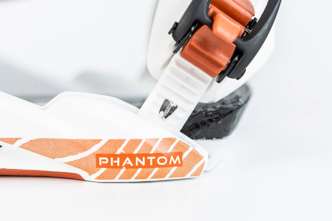 Nitro Phantom Snowboard Bindings 2025 - A white snowboard binding with an orange strap and black buckles.
