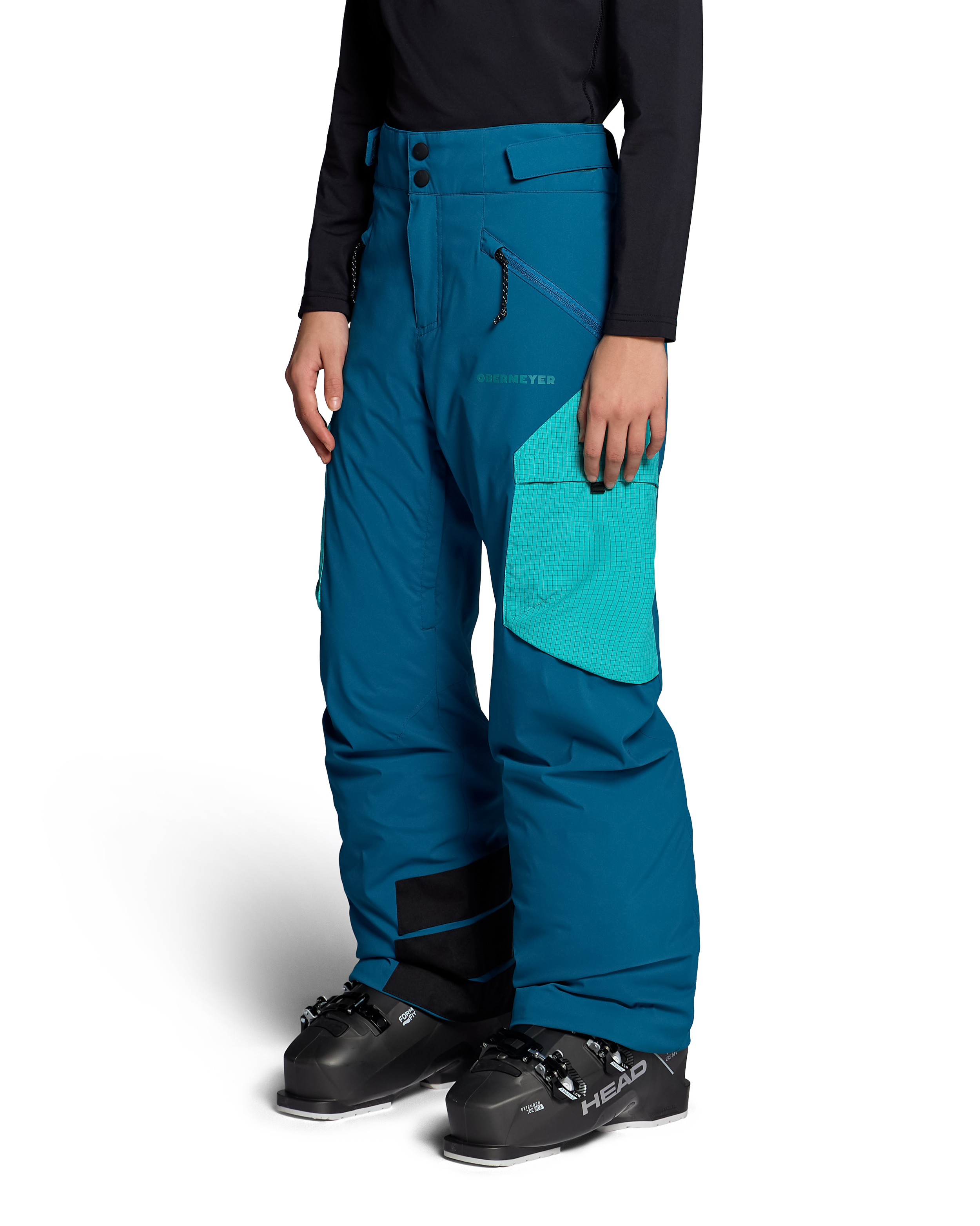 Obermeyer Jr. girls' insulated ski pants, Corsair teal, side view with zips
