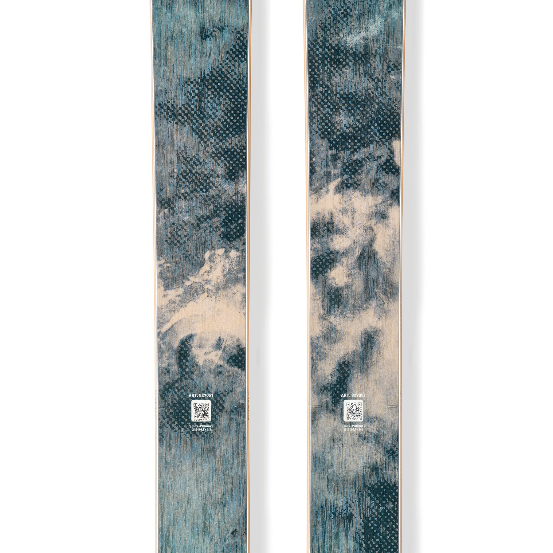 Teal skis with gold trim and circular brand logos, full-length pair.
