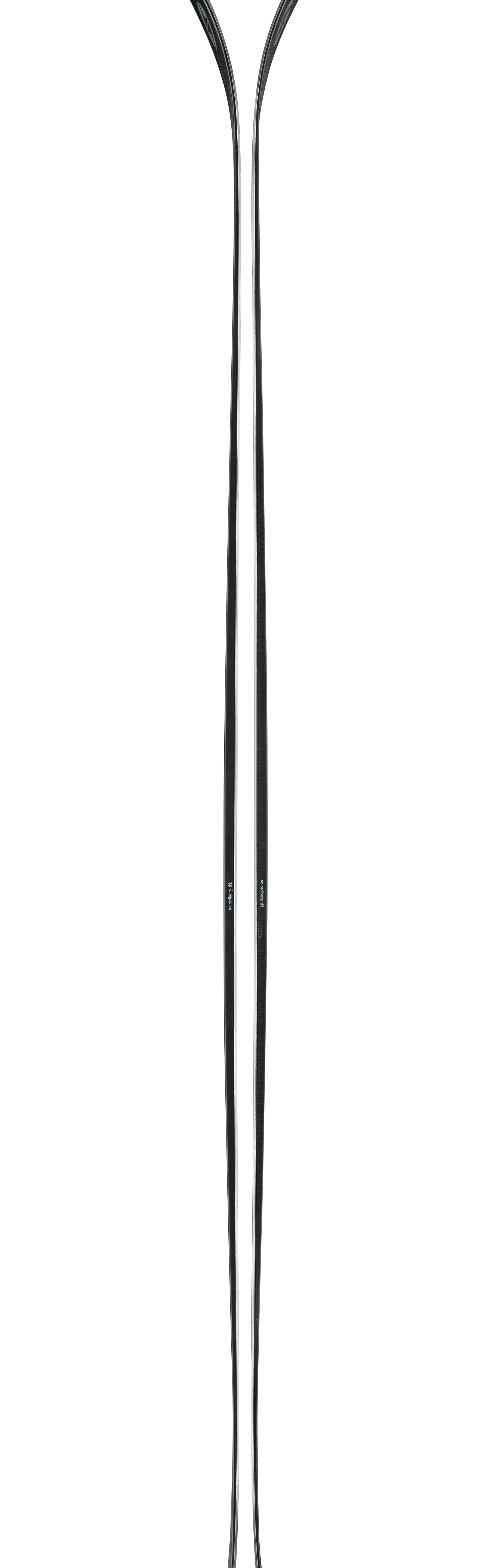 Pair of skis with long slender shape, light base and dark tips