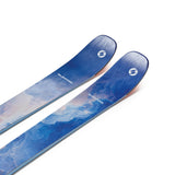 Two blue skis shown in angled view, textured sky graphic on topsheets