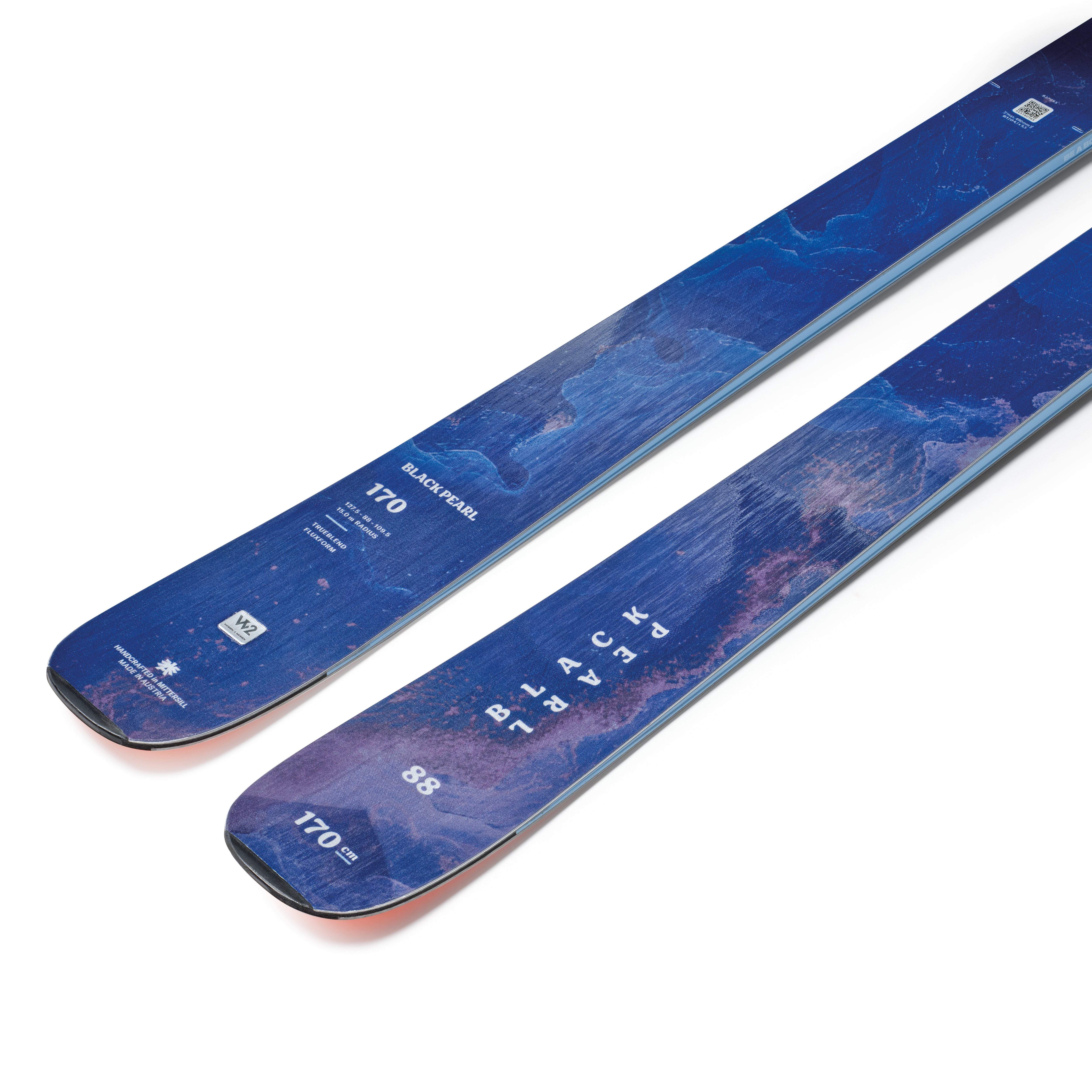 Blue alpine skis close-up with rocker profile and printed size markings