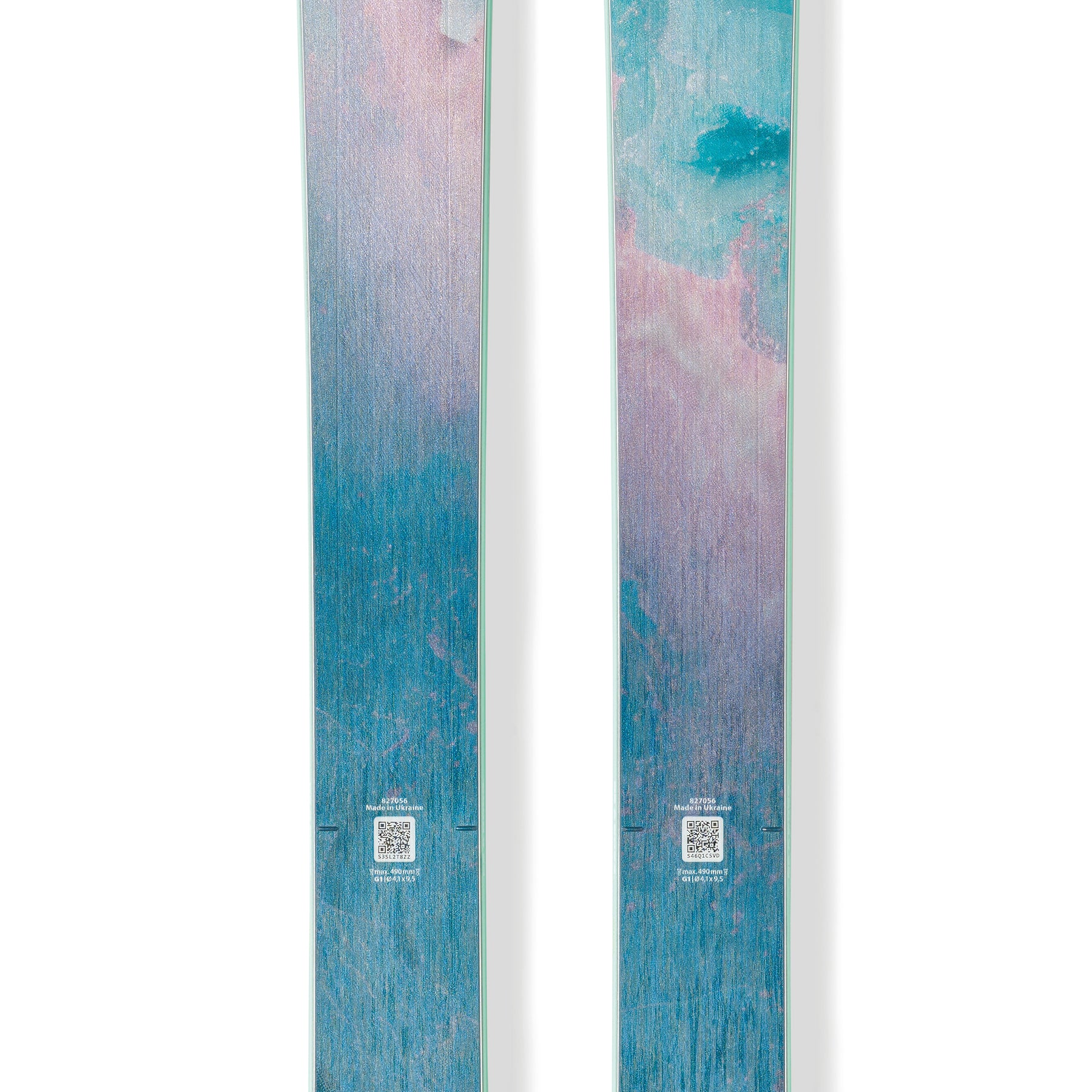 Pair of Blizzard skis, teal blue with pink gradient tips and logo emblems