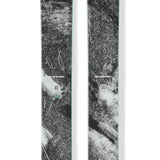 Pair of black skis with teal logo, mint edge, and textured graphic tops.