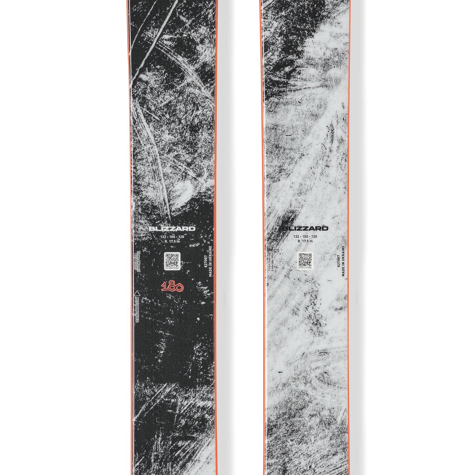 Pair of black, gray speckled skis with orange center stripe and Blizzard logo