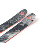 Two black skis with gray speckled tops and orange edges, angled view
