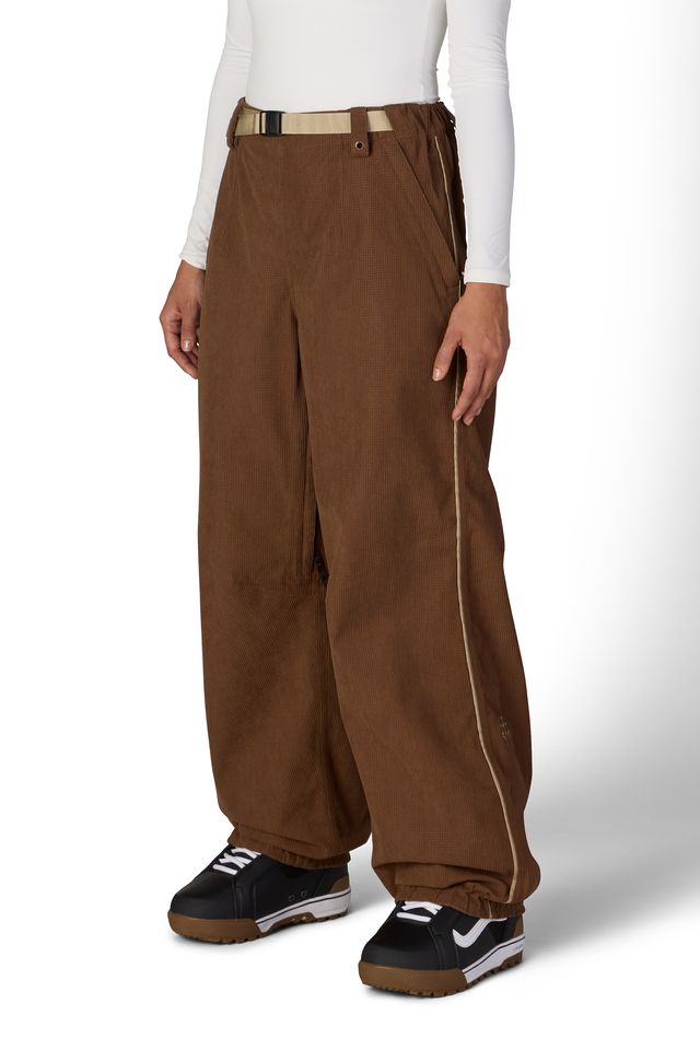 Brown shell pants with belt loops, side pockets, and relaxed wide legs
