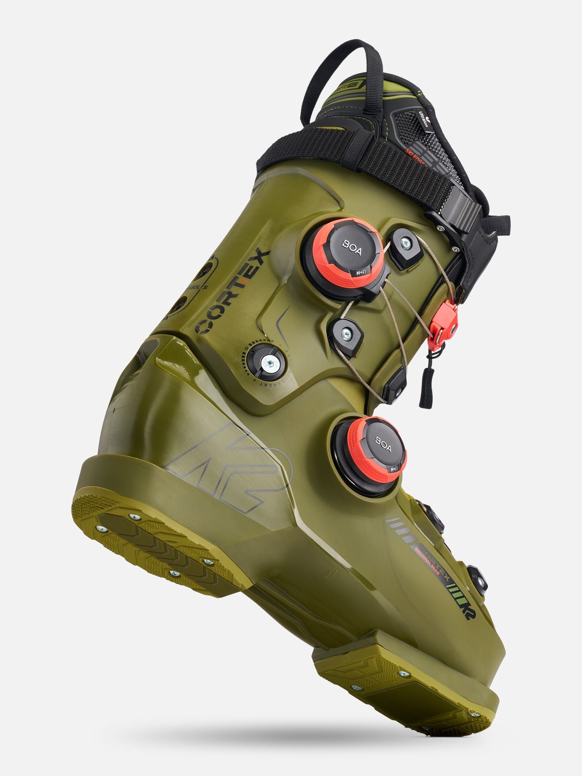 K2 Cortex 130 Zonal BOA ski boots feature a black and green design with a visible BOA dial.