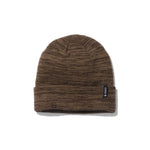 Stance Cosmics 2024 - A brown beanie with a subtle marbled pattern and a black tag on the cuff.