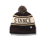 Stance OG Pom Beanie 2024 - A black beanie with a tan stripe and a brown pom-pom on top.