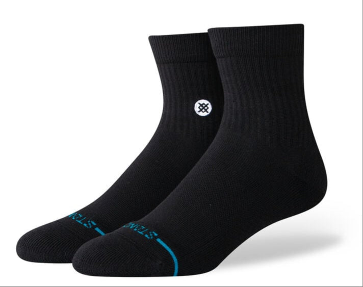 Stance Icon Quarter Sock 2025 - Black socks with a white logo on the ankle area.