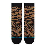 Stance Animalistic Crew Sock 2024 - A pair of tan crew socks with a black animal print design.