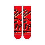 PELTER CREW SOCK 2024 - Red crew socks with black abstract pattern and small red logo on top.