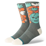 SKELLY NELLY CREW SOCK 2024 - A pair of gray crew socks with a large teal skull graphic on the top portion, surrounded by orange and white leaves.