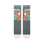 SKELLY NELLY CREW SOCK 2024 - A pair of crew socks with a repeating pattern of teal and orange skulls, leaves, and flowers.