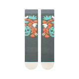 SKELLY NELLY CREW SOCK 2024 - A pair of crew socks with a repeating pattern of teal and orange skulls, leaves, and flowers.