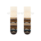 Stance Have Some Eggnog Crew Sock 2025 - Brown crew socks with a festive Christmas design featuring snowflakes, trees, and eggnog mugs.