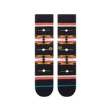 Stance Cloaked Crew Socks 2023 - Black crew socks with a repeating pattern of orange and pink cloaked shapes.