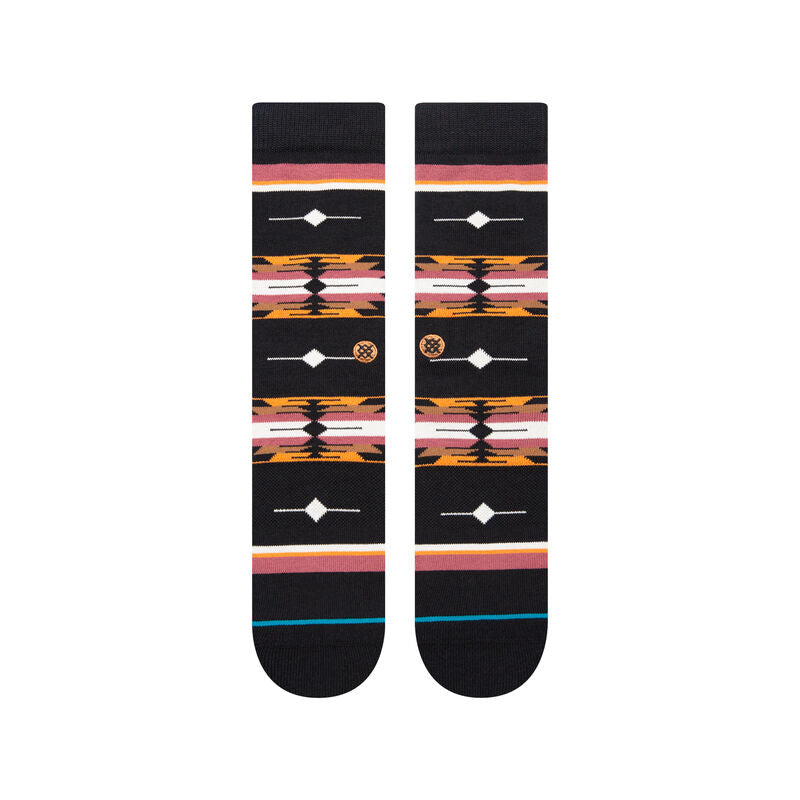 Stance Cloaked Crew Socks 2023 - Black crew socks with a repeating pattern of orange and pink cloaked shapes.