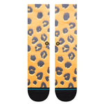 TABOO CREW C SOCK 2023 - A pair of crew-length socks with a leopard print design in shades of gray and tan on an orange background.